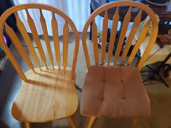 2 solid wood chairs.