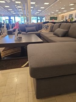 Sectional with big coffee table and a rug