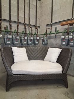 Wicker Loveseat with White Cushions