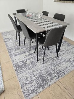 Gray extendable dining room table set for 6 with 6 leather chairs