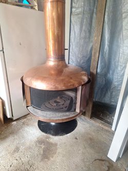 Selling a Highly Collectable,Authentic Vintage 32in Malm Fire Drum 2 Free Standing  Wood-Burning Fireplace in a Rare, design Copper finish.