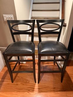 Pair of Arhaus Bar Stools in Great Condition Black wood and leather 19wx16sd x29.5sh x 45.5h Smoke free household.