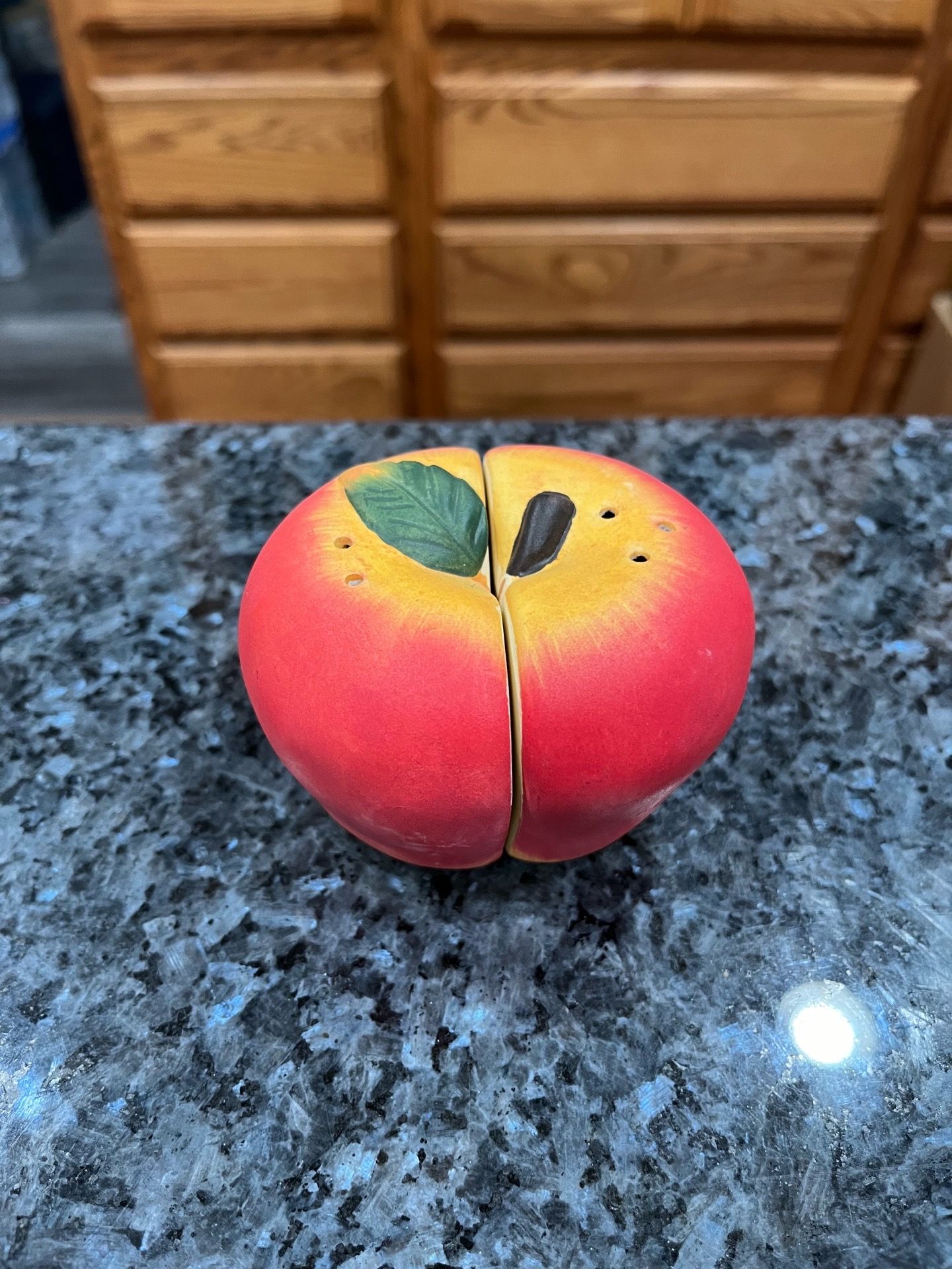 Vintage Ceramic 1960’s Red Apple Halves Pair of Salt and Pepper Shakers. Size Approximately 2 1/2 inches tall. Preowned.