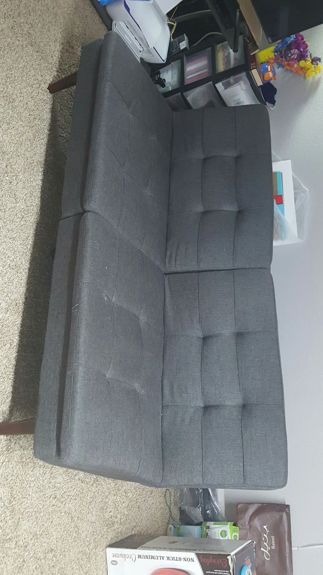 Grey sleeper sofa with coffee table used only 2 months by a single person student. PRICE NEGOTIABLE.
