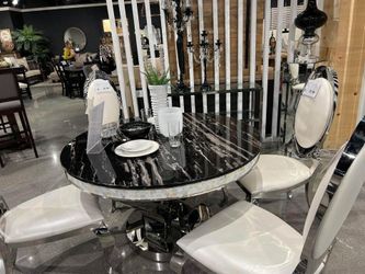 Brand New Dining Set  Luxurious chrome and black marble finishes.  Sculptural table base with artistic curves.  Iridescent mosaic glass tile edge. Rea