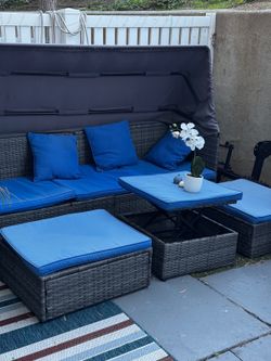 4-Piece Outdoor Wicker Patio Sofa Set with Canopy, Ottomans & Table
