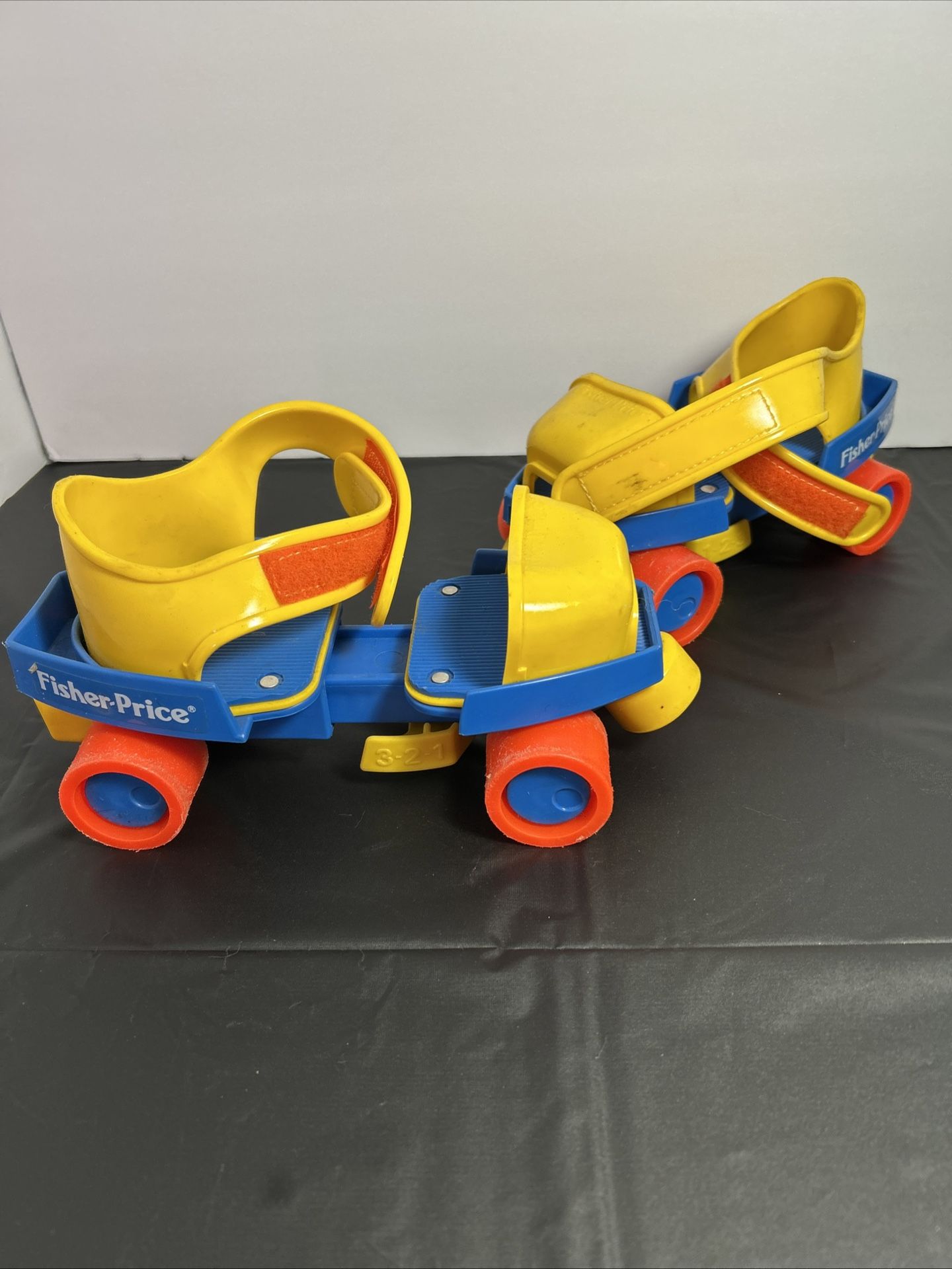 Vintage Fisher-Price roller skates, likely from the 1980s
