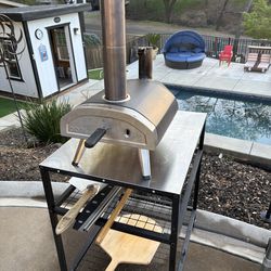 ooni pellet pizza oven with table carrying bag and pizza tools see picture works amazing