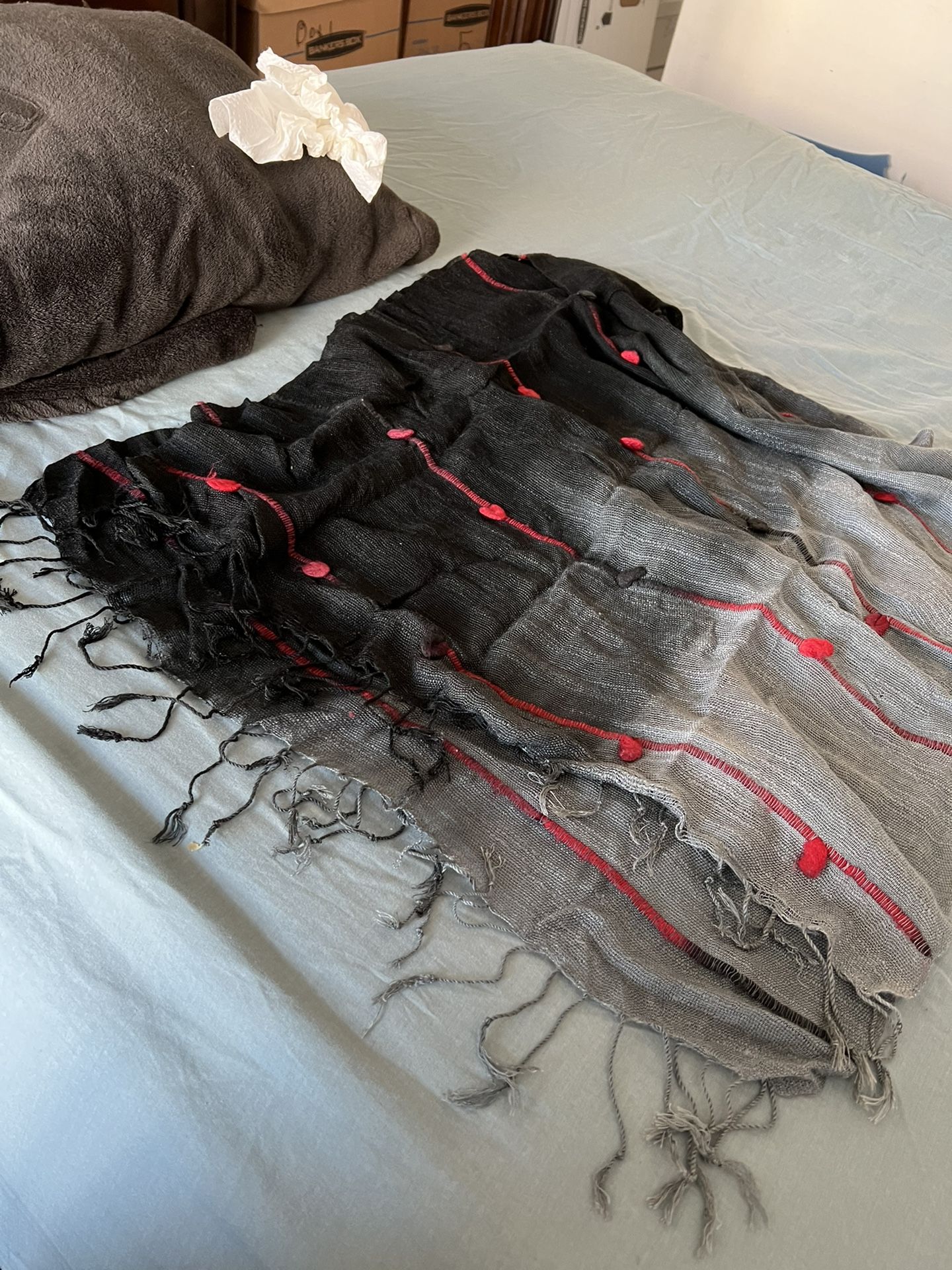 Scarf Wrap Avant Garde Ombre Style Black  with Red Knots Hanging Balls Fringe.  64” length x 20” width Has stretch weave material  Comes from a pet an