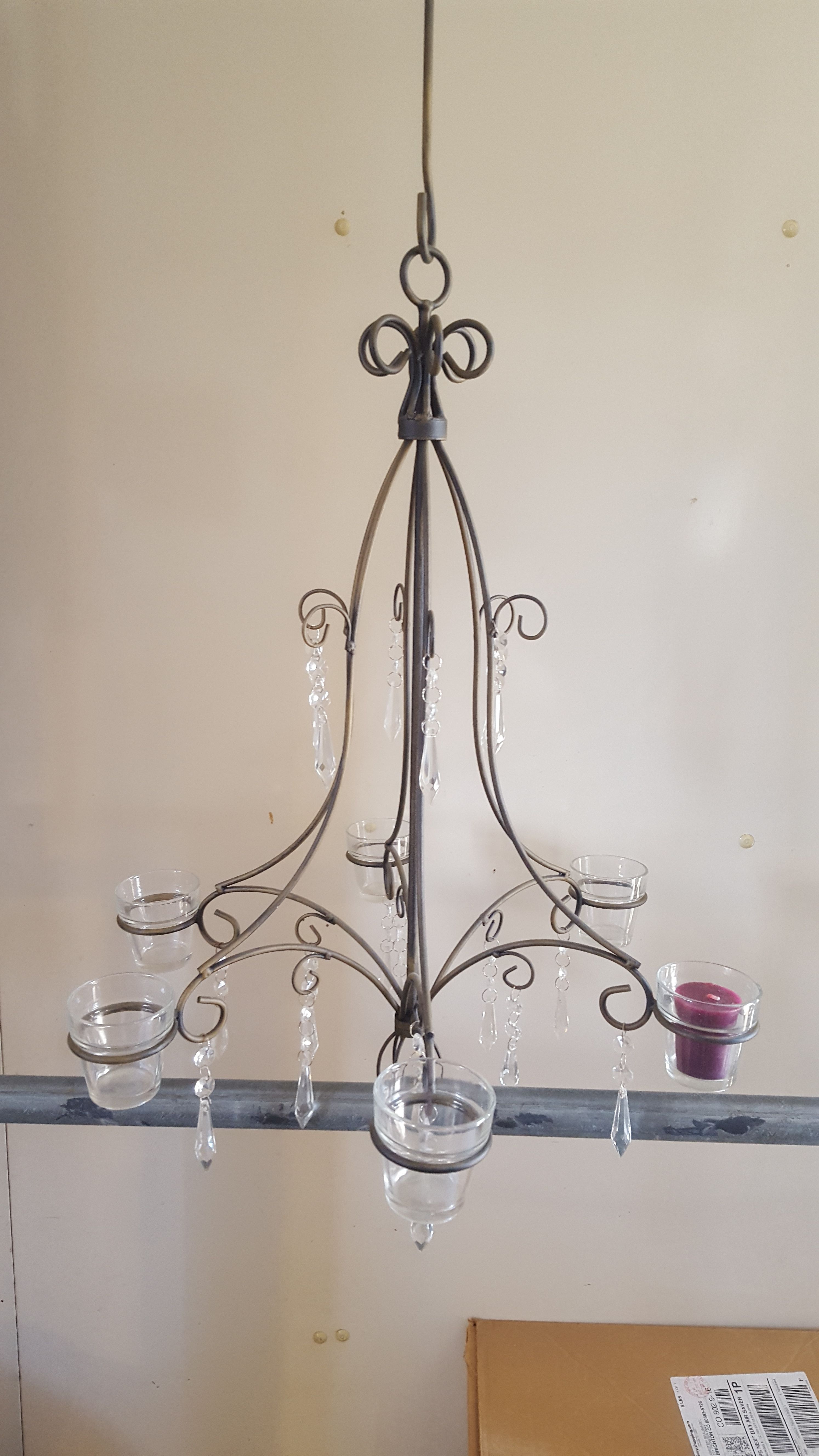 Unique vintage rod iron candle chandelier can hold 6 candles. Like new been in storage. Sell for over 100 asking 30