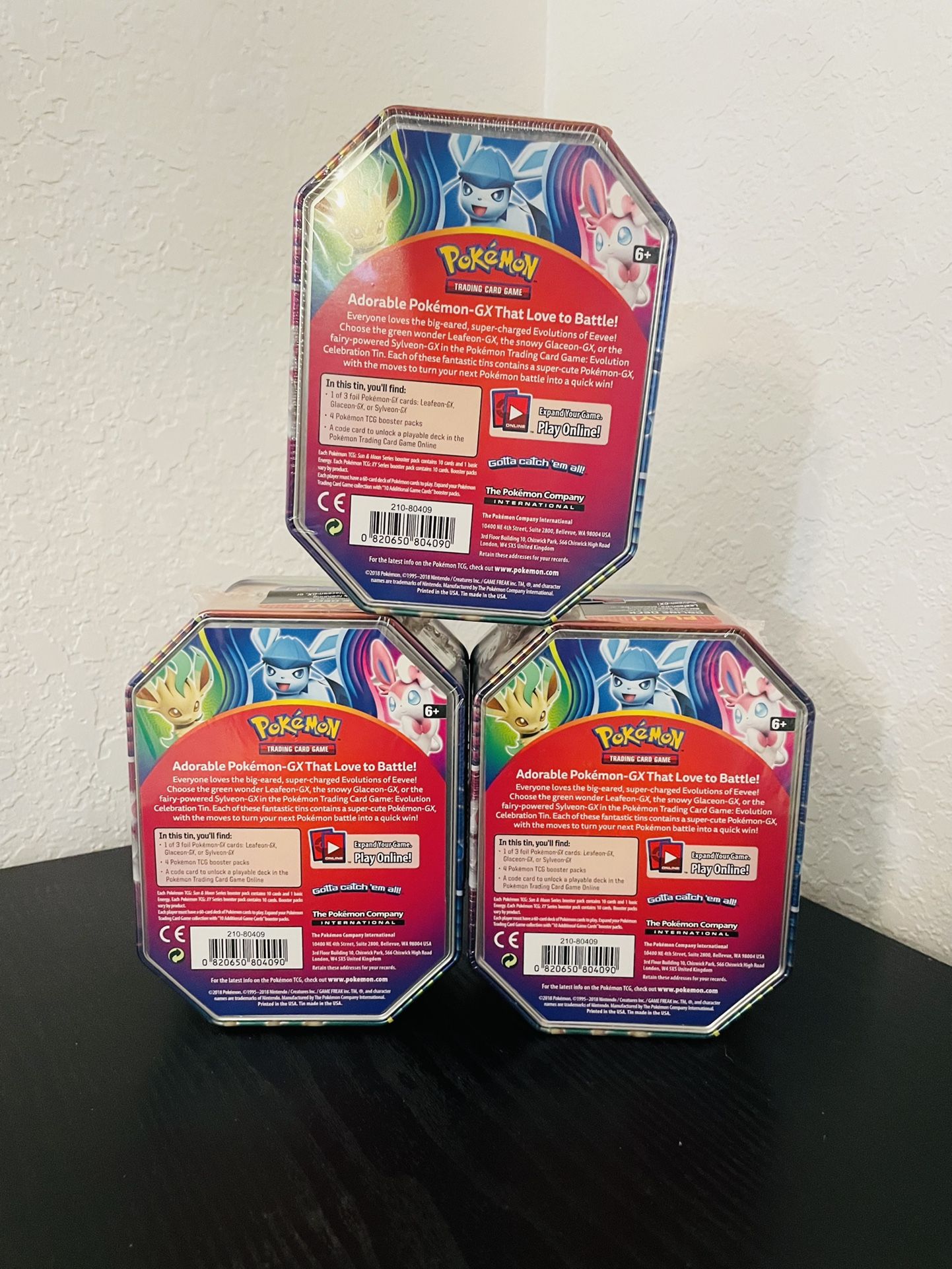 Pokémon TCG: Evolution Celebration Tin (Leafeon-GX) and 1 of 6