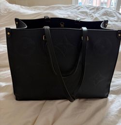 Louis Vuitton OnTheGo GM Tote in Black Embossed Monogram