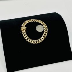 10k gold thick heavy solid cuban link bracelet, 9.5" long, about 1/2" thick, wights 81.8 grams