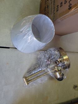 Merra plug in or hardwired swing arm wall sconce light fixture in gold