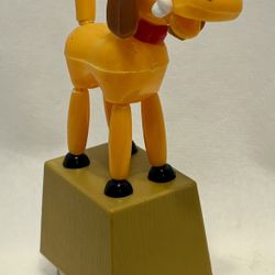 MODERN TOYS plastic dog push puppet with bone; also a pencil sharpener