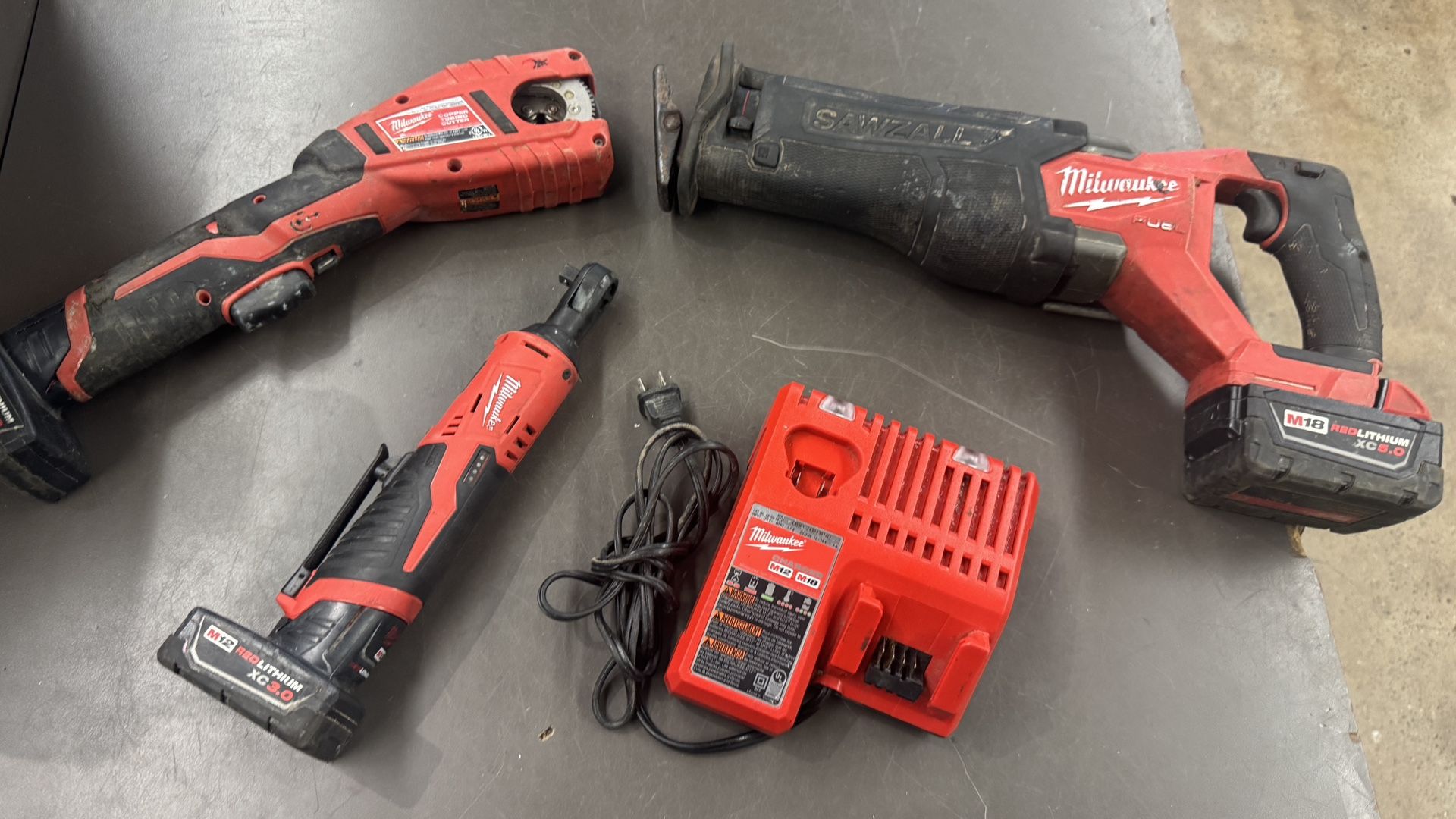 Milwaukee 3 pc combo set sawzall  3/8 ratchet copper tubing cutter w batt chrg nothing sold separate no trades pick up on Tacoma FIRM PRICE