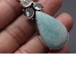 Aquamarine teardrop shaped pendant with quartz