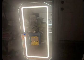 frameless rectangular LED bathroom mirror measuring 24 inches wide by 46 inches high.