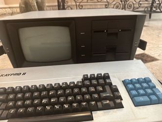 Kaypro 2 computer with carrying case and disks
