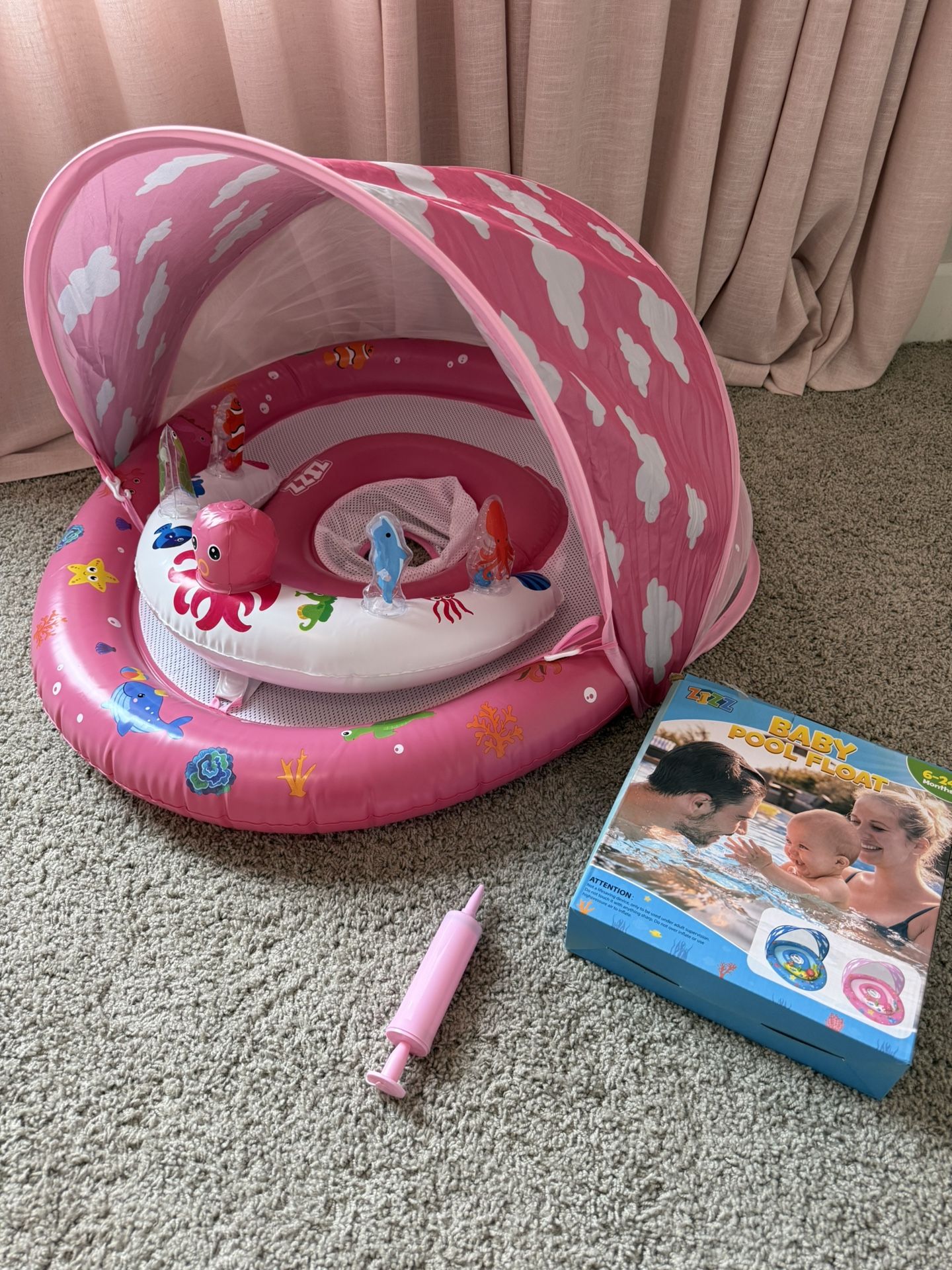 New pink swimming ring.