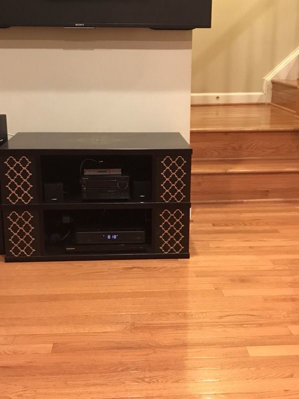 TV stand with decorative shelves on the sides
