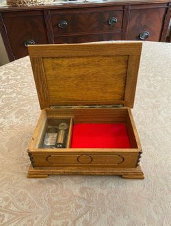VINTAGE “REUGE” HAND CARVED WOODEN MUSICAL / JEWELRY BOX (CIRCA 1960’s) MADE IN SWITZERLAND (10”L X 6.5”W X 3.5”H)