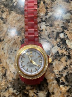 Invicta, Diamond bezel pink strap woman’s watch