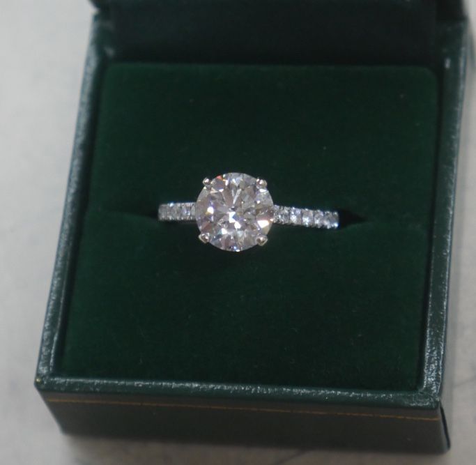 14KT WHITE GOLD ENGAGEMENT RING 3.9 GRAMS ; SIZE 6.5 ; WITH LAB CREATED ROUND DIAMOND E VS1 2.42 CARATS ; 30 SIDE DIAMONDS ( NATURAL ) APPROXIMATELY