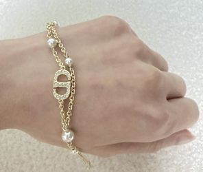 Bracelet from brand D, I've never worn it before, but it has an adjustable chain. It's out of original packaging, but I just want to wear it for fun. 