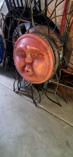 celestial sun face wall sculpture