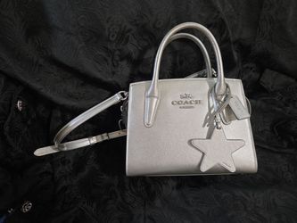 Coach  silver star handbag w/crossbody strap like new no flaws . $520.00 tag will sacrifice for $350.00. Thank you 😊