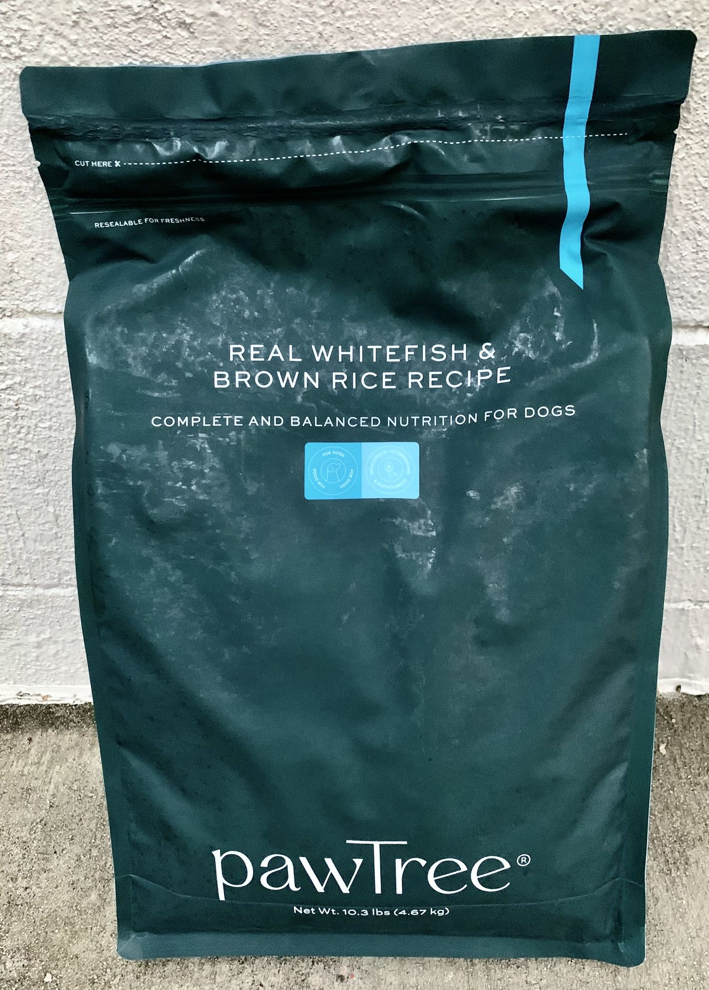 This is a sealed bag of Pawtree Real Whitefish & Brown Rice Recipe flavored dog food. This popular dog food can be served by itself or used as a food