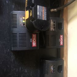 Three Ryobi Chargers And One Battery 