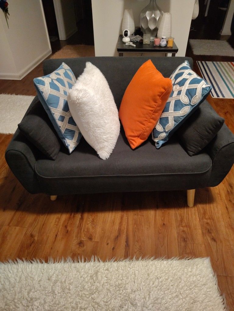 A CUTE BLUE SOFA CAN HOLD 300 POUND PERSON