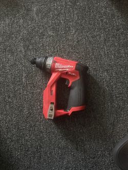 Two Milwaukee impact drills