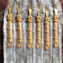 6 Gold tone cocktail or oyster forks