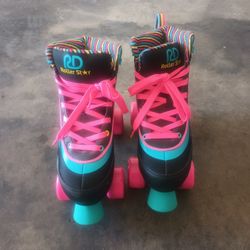 2 Pair Of Rolling Skates 