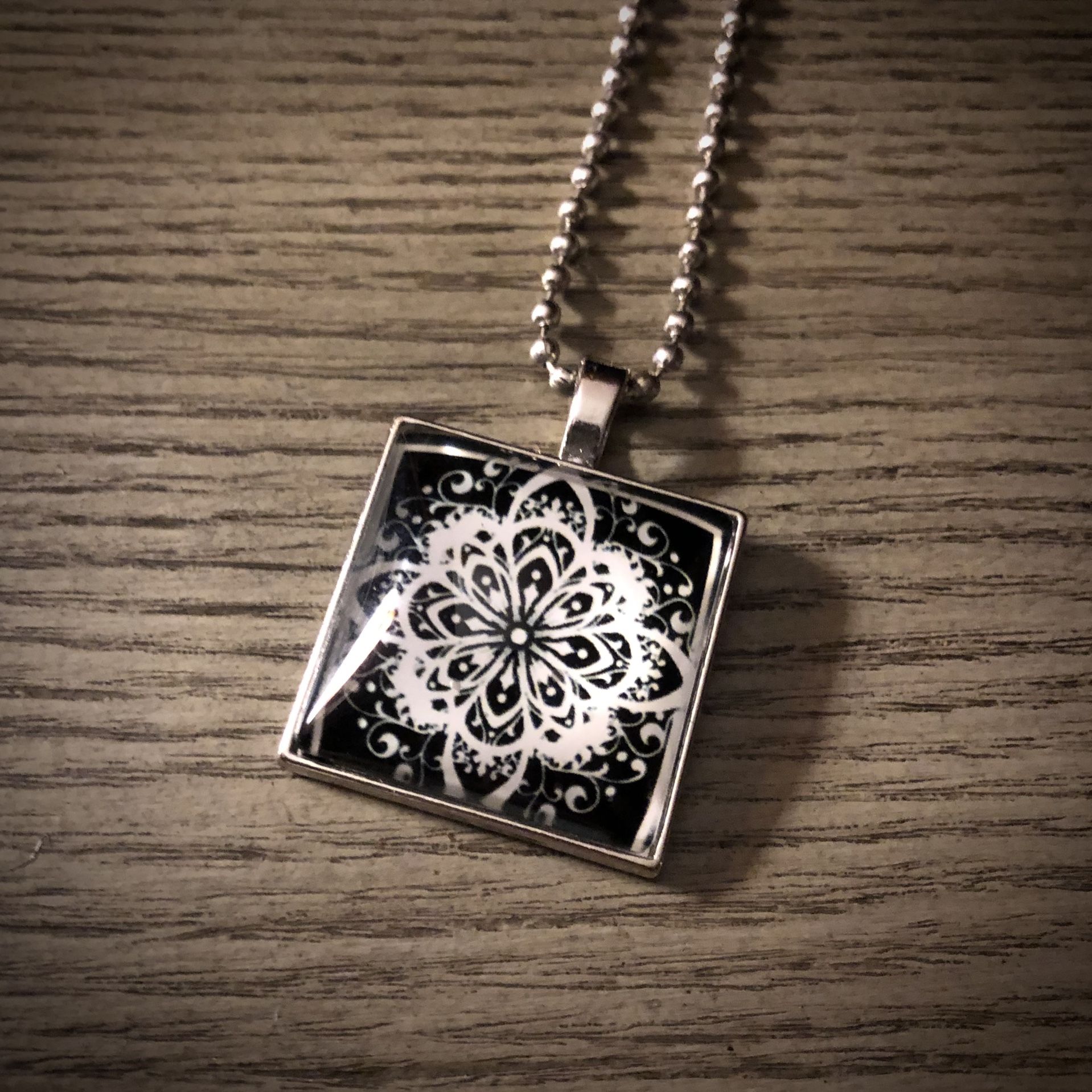 NEW - Silver, Black And White Floral Design Pendant and 24” Chain