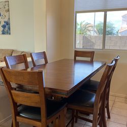 Counter height, dining table, and six chairs