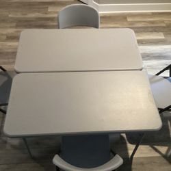 Two Folding Tables And Four Folding Chairs 