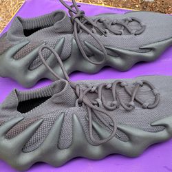 Adidas Yeezy 450 sneaker, likely in the 'Cinder' or 'Utility Black' size 13
