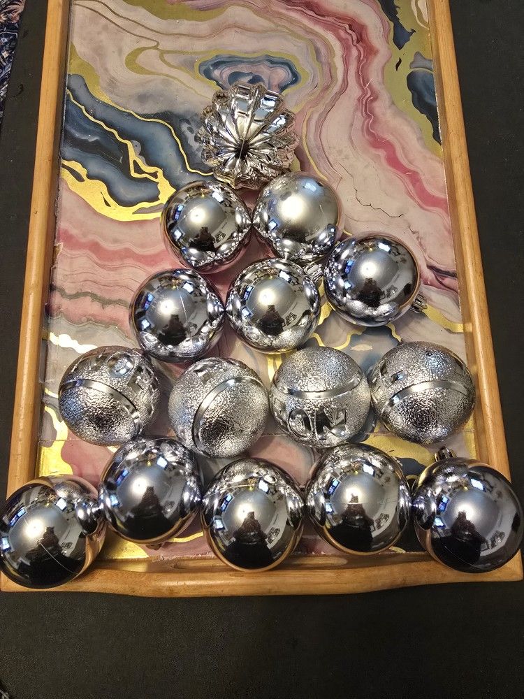 15 CHRISTMAS TREE ORNAMENTS THE COLOR IS SILVER$4