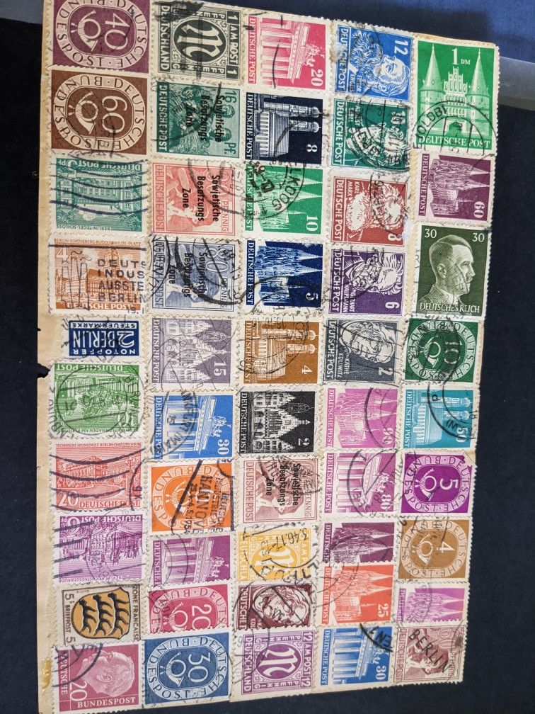 50 Used German Stamps On Paper Cutout