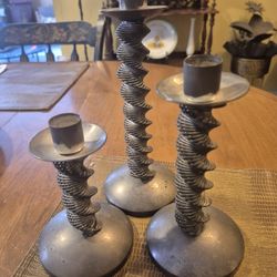 Set of three silver plated spiral candleholders