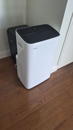 Toshiba portable air conditioning in white.