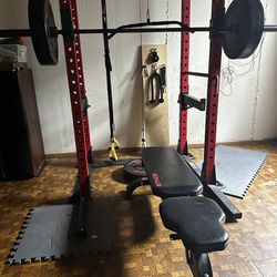 Ethos Power Rack 1.0 with barbell, bench, and attachments