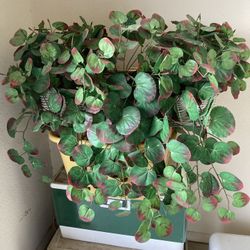 Fake Plant In White Wicker Basket