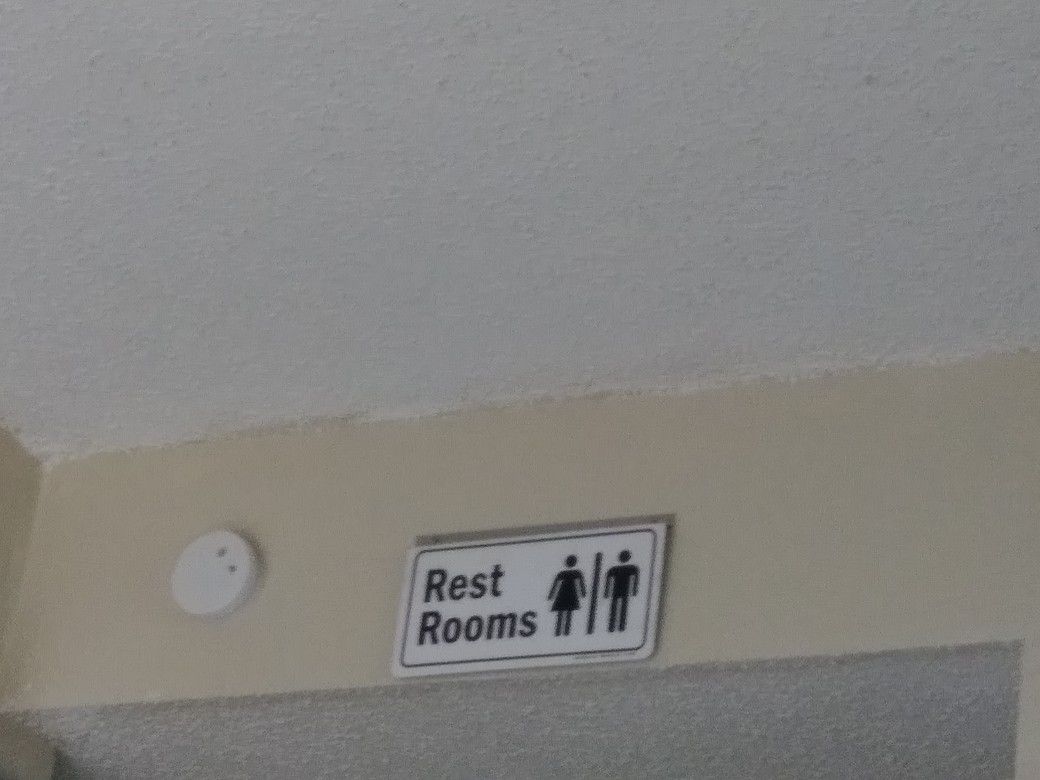 $1 restroom sign