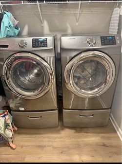Samsung Front Load Washer and Dryer Set with pedestals