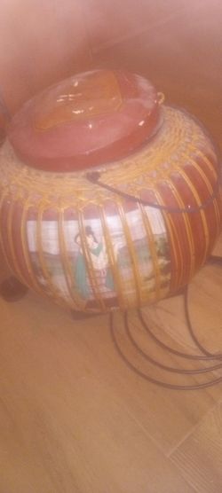 Round Chinese basket with lady picture on it